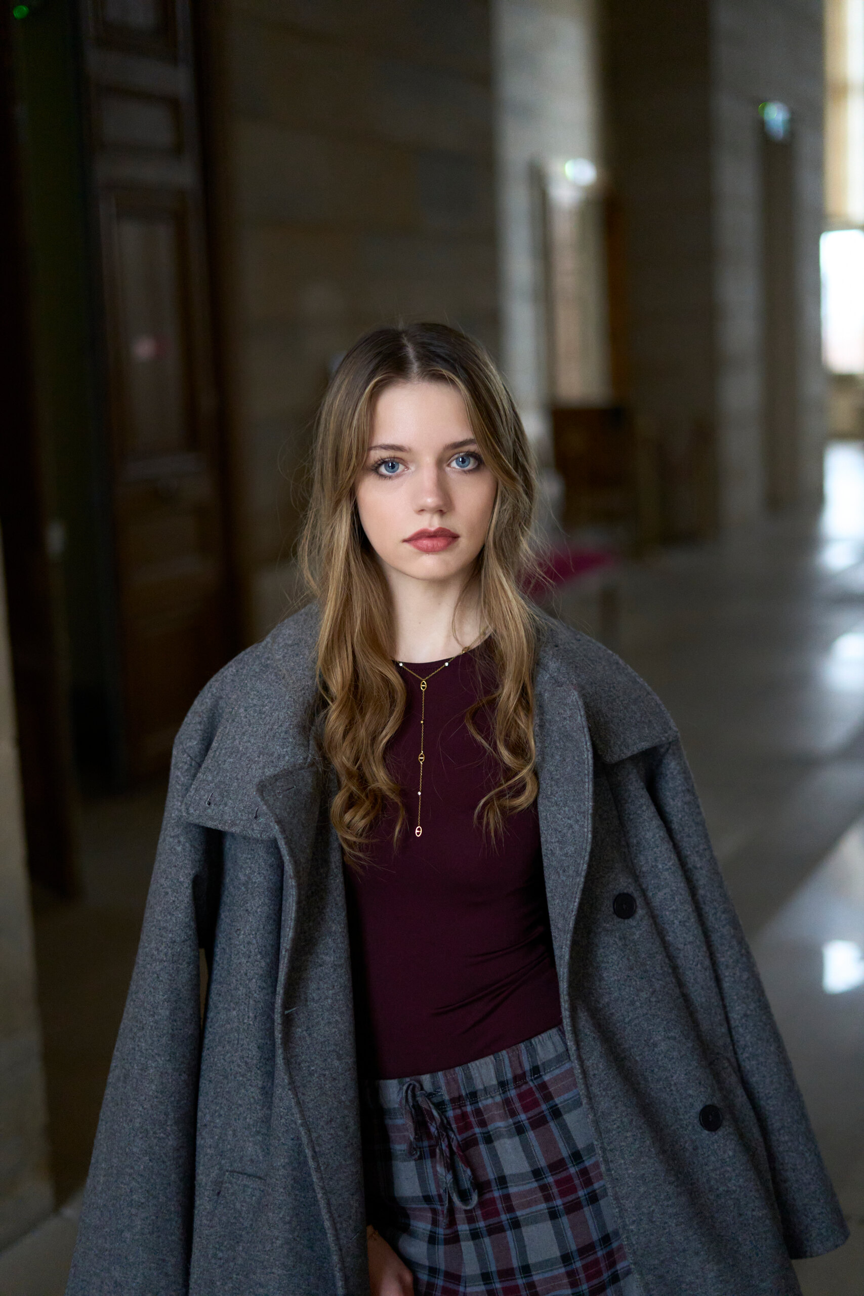 Portrait under a stone arcade